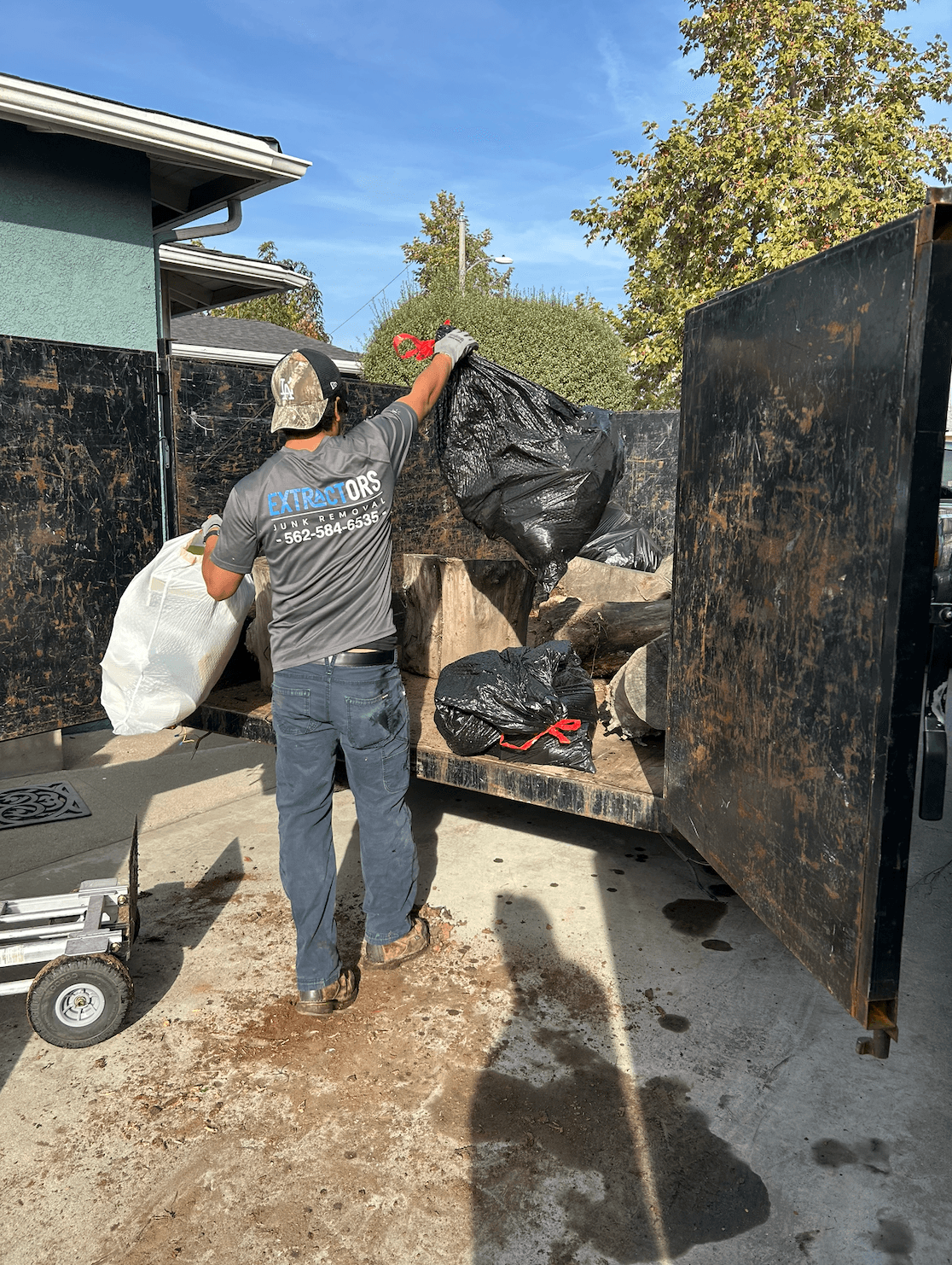 Extractors Junk Removal truck and crew on a Cypress job